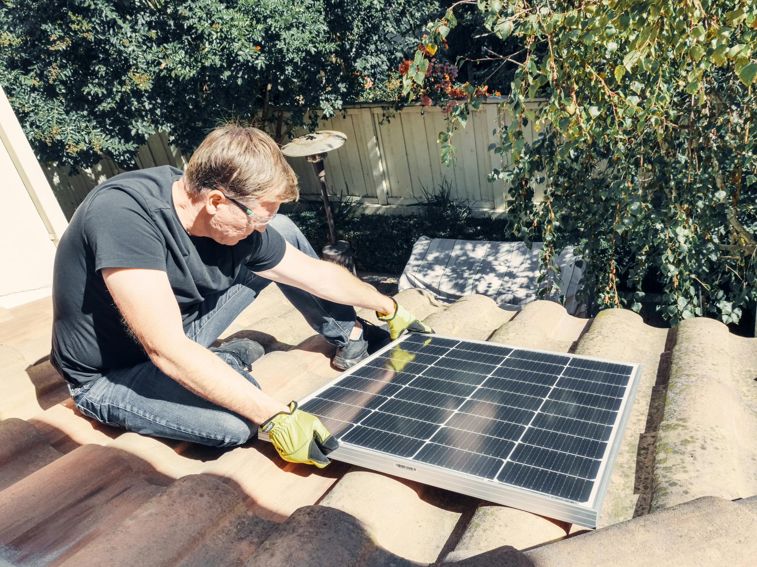 Man installing a solar panel